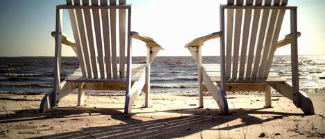 On the beach, sun loungers, beach towels