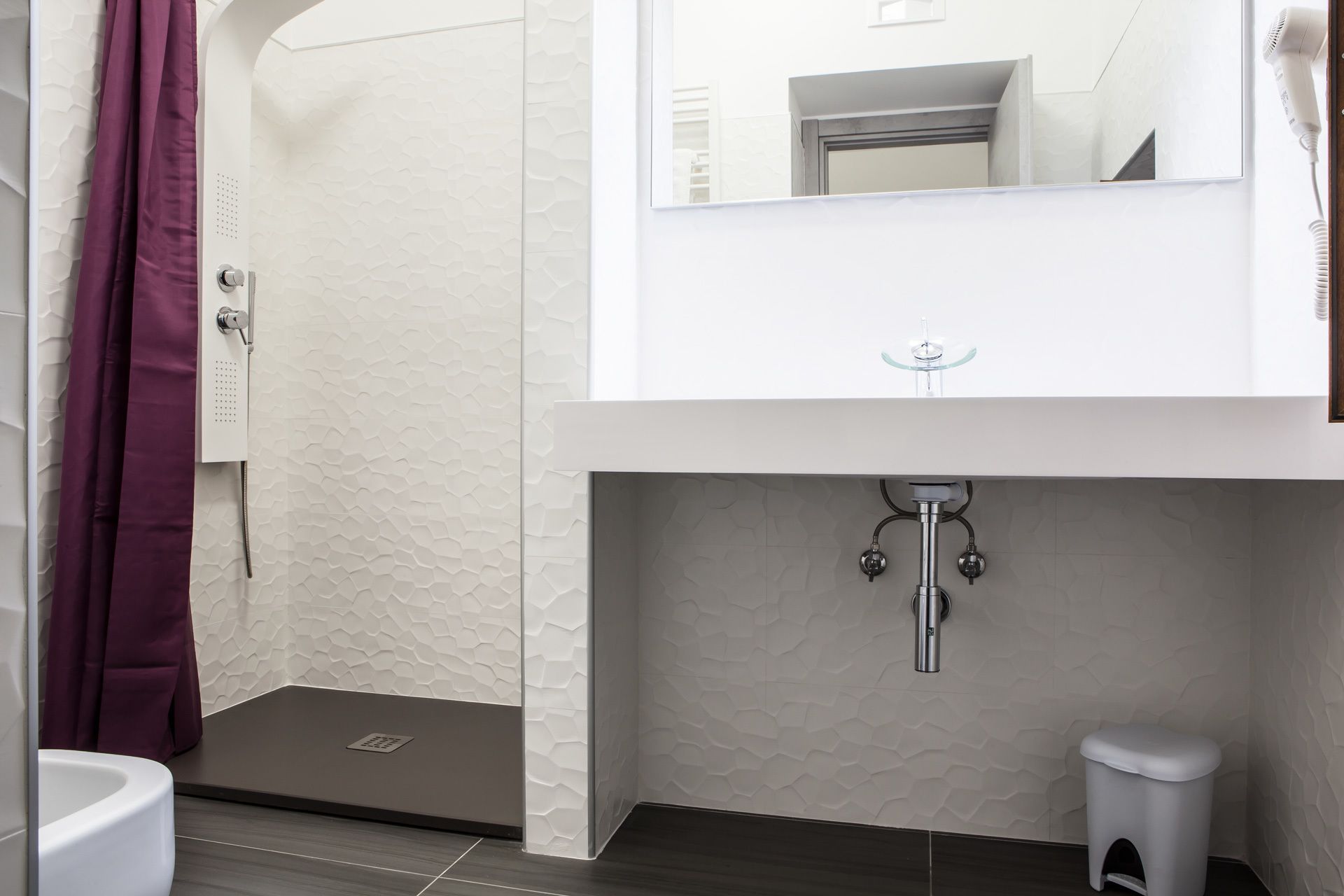 Bathrobes, slippers, bidet, towels
