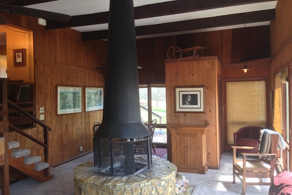 Beautiful 360 degree open fireplace. (wood not provided)