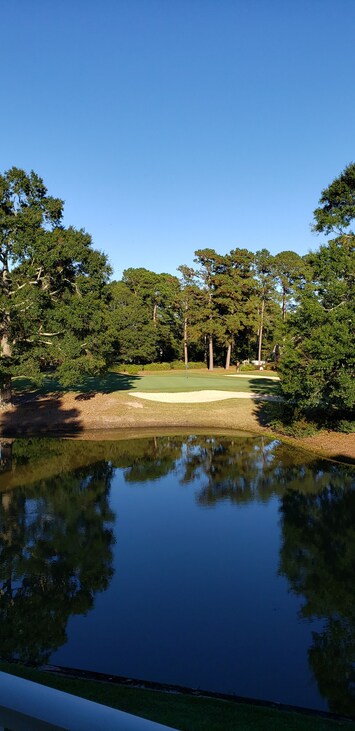 view from the balcony of the 8th green of Magnolia golf course