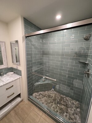 Shower, hair dryer, towels, soap