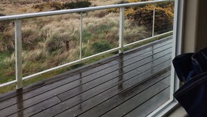 A view from a room with a window overlooking a beach. - Ocean Front ON the Beach - Spectacular Views! 14 Minutes to Bandon Dunes Golf! (Bandon)