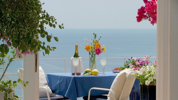 A terrace with a table set for two, overlooking the sea. - great sea view - great position - not far from the town center (Positano)