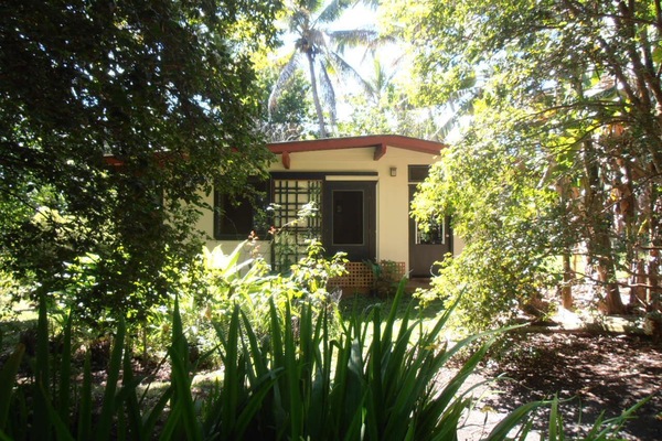 The Honey House is a bungalow in a tropical garden