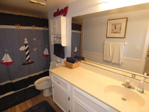 Combined shower/bathtub, hair dryer, towels, soap - Stunning Ocean Beach Front Condo, Two King Beds, with Cottage Charm (Redington Shores)