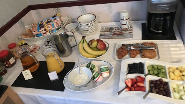 A breakfast buffet with various food items, including fruits, pastries, and condiments. - Doriam (Bridlington)