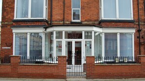 A corner building with a bay window and a sign reading "The Bortham Hotel". - Doriam (Bridlington)