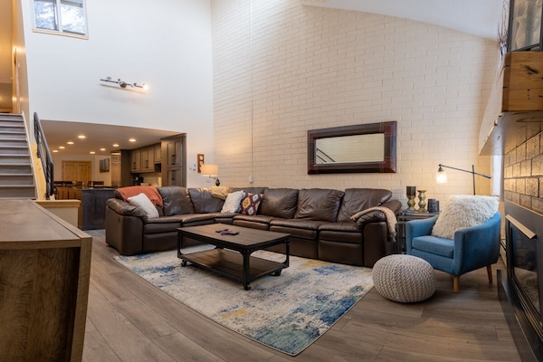 Large airy living room. Sectional with two built-in recliners and sleeper