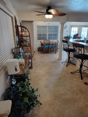 Enjoy cooking and dining in this well-equipped kitchen with a central island, coffee maker, and dining area.