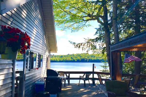 Outdoor deck and gazebo have full view of lake activity.