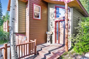 A wooden cabin with a porch, a welcome sign, and a mailbox. - High Point Chateau 4 Bedroom Home by RedAwning (Breckenridge)