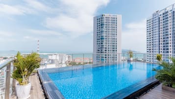 Outdoor pool, open 6:00 AM to 6:00 PM, pool umbrellas, pool loungers