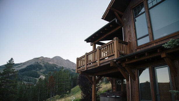 A wooden house with a balcony overlooking a mountainous landscape. - Moonlight Magic!  Best Views In Big Sky!  True Ski-In/Ski-Out!  Heated Ski Room! (Big Sky)