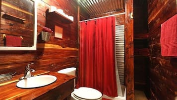 Bathtub, towels, soap, shampoo