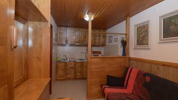 Apartment, 1 Bedroom | Living room | Flat-screen TV