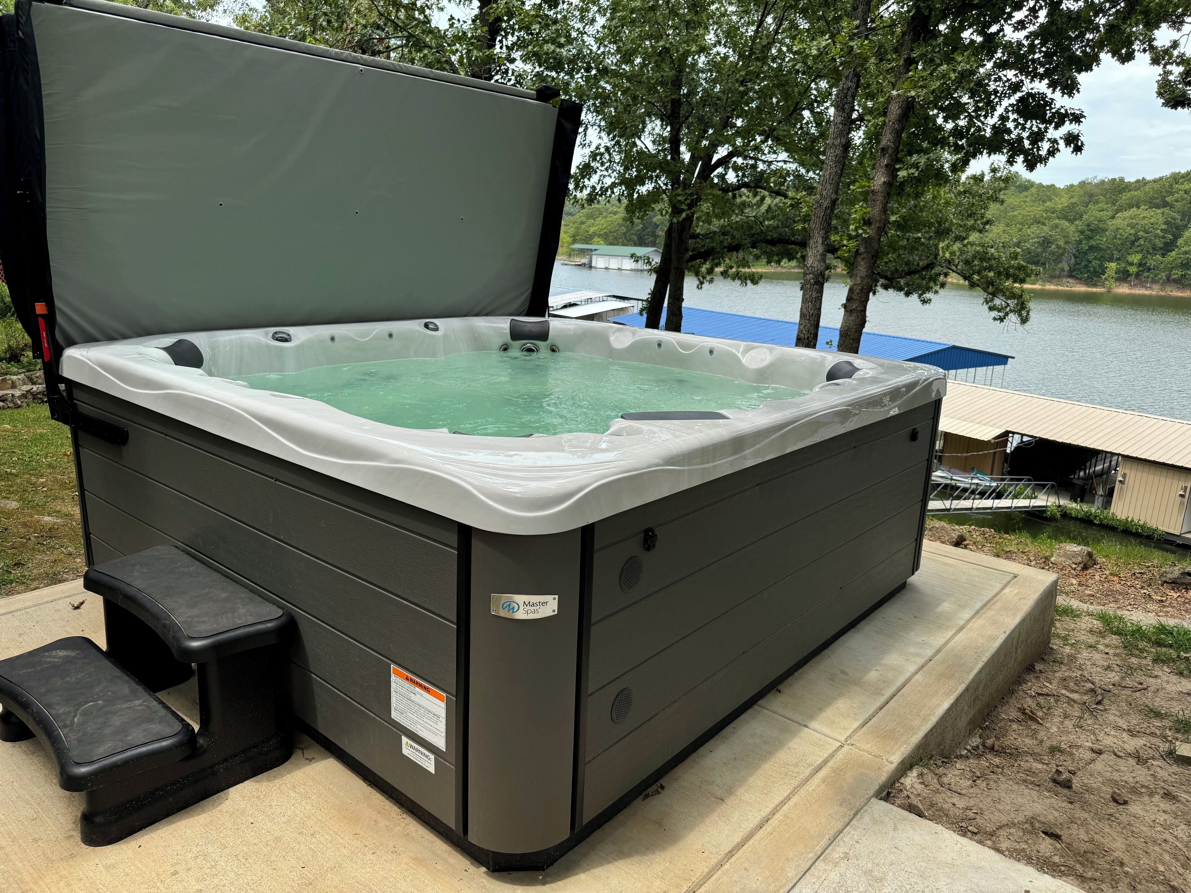 Waterfront beauty with dock and fireplace! Check in Bay! New Hot Tub!!