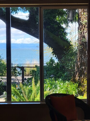 Great Price! Sunset Beach Cottage with Lovely garden, beach, and boat dock!