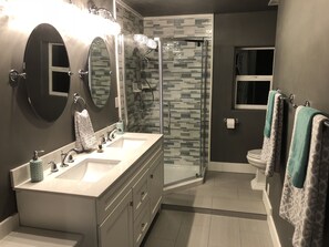 Shower, hair dryer, towels, soap