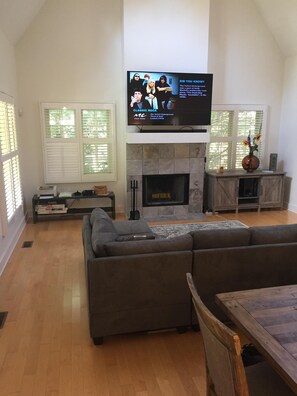 TV, fireplace, books, printers