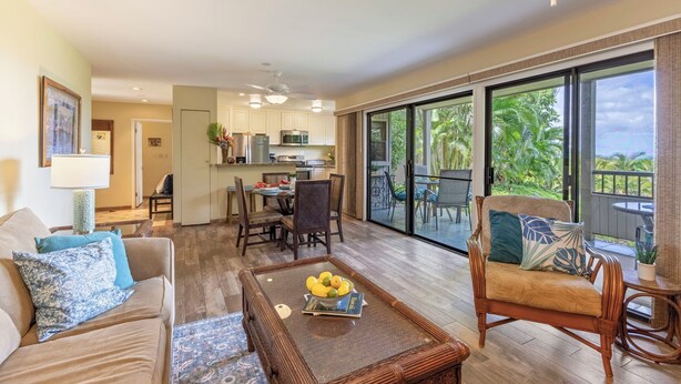 A spacious living area with a dining table, a sofa, and a chair. - WAILEA JEWEL; NEAR BEACHES; SHOPS/5 STAR HOTELS; CONVENIENT! (Kihei)