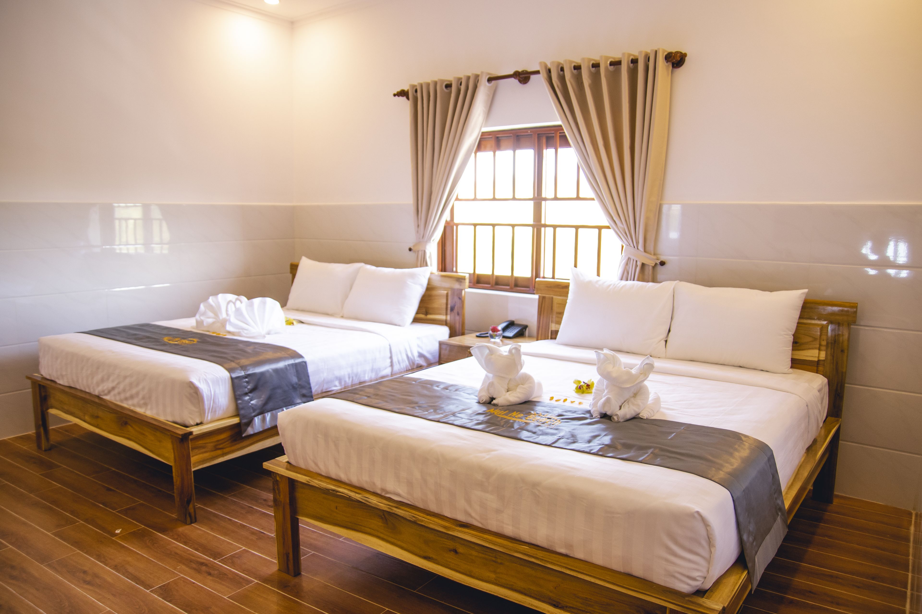 family double room, 2 queen beds, private bathroom, garden view | 1 bedroom, select comfort beds, minibar, individually furnished