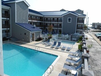Adult pool area with plenty of seating.