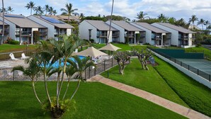 A hotel with multiple-story buildings, a swimming pool, and well-maintained lawns. - Just Steps to Kamaole III Beach!!! (Kihei, Maui)