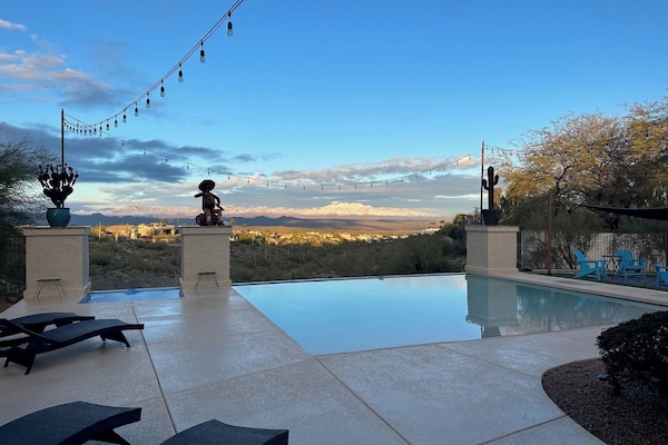 Breathtaking views of the Emerald Wash & Four Peaks in this tranquil backyard.