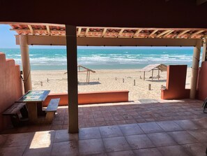 On the beach, sun-loungers