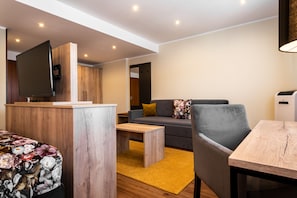 Superior Double Room | Living area | Flat-screen TV