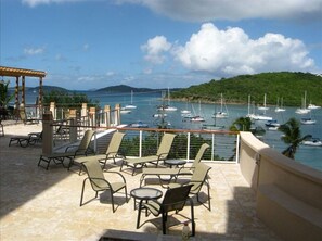 Relax on the furnished terrace with a view of the marina and sailboats.