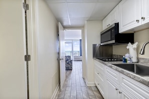 Fridge, microwave, stovetop, coffee/tea maker