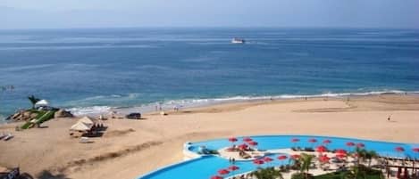 On the beach, sun loungers, beach towels