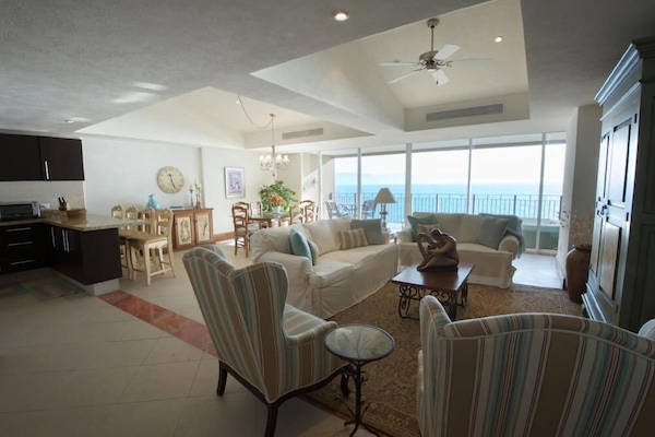 Spacious living and dining room directly on the beachfront.
