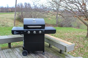A portable grill on a wooden deck with a bench. - Fabulous Lodge w/ Breathtaking Views in HH & WNF (Nelsonville)