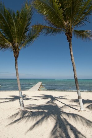 On the beach, beach towels - Stunning 2BR beachfront condo (West Bay)
