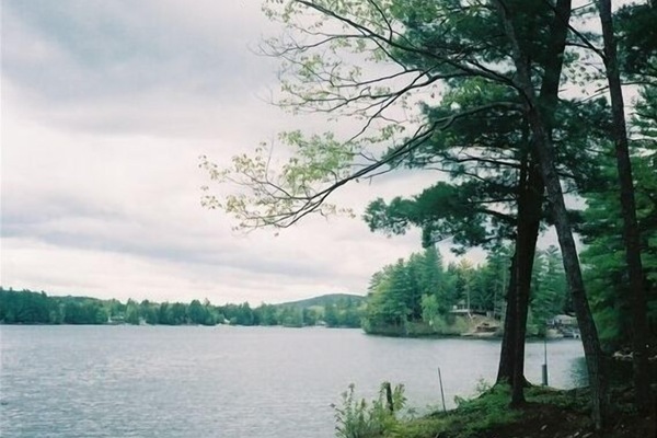 Photo from the front of the cottage of Sokokis Lake and canoe.