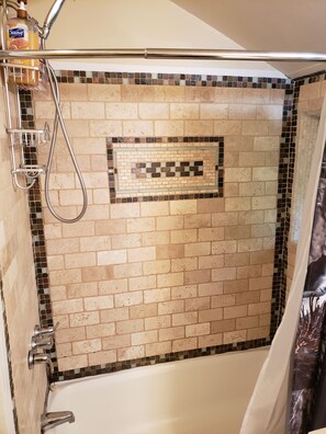 Bathtub, hair dryer, towels, soap