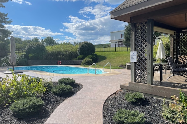 Your own private pool with lounge chairs and 2 patio tables and lots of chairs