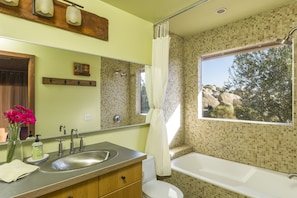 Bathtub, hair dryer, towels, soap