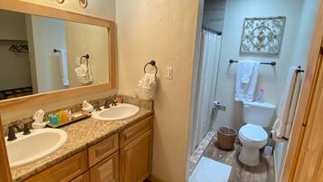 Combined shower/tub, hair dryer, towels, soap