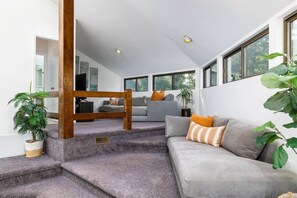Smart TV, fireplace, books, printers