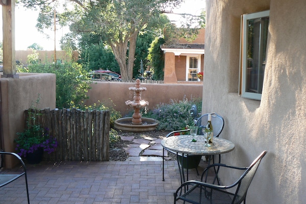 Enjoy a beverage or dining al fresco on the side portal.