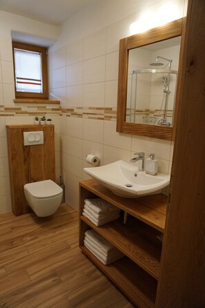 Shower, free toiletries, hair dryer, slippers