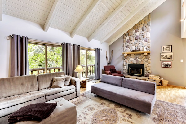 Comfy couches and wood burning fireplace in the great room