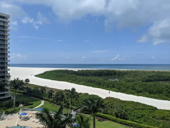 A resort with a view of a beach and ocean.