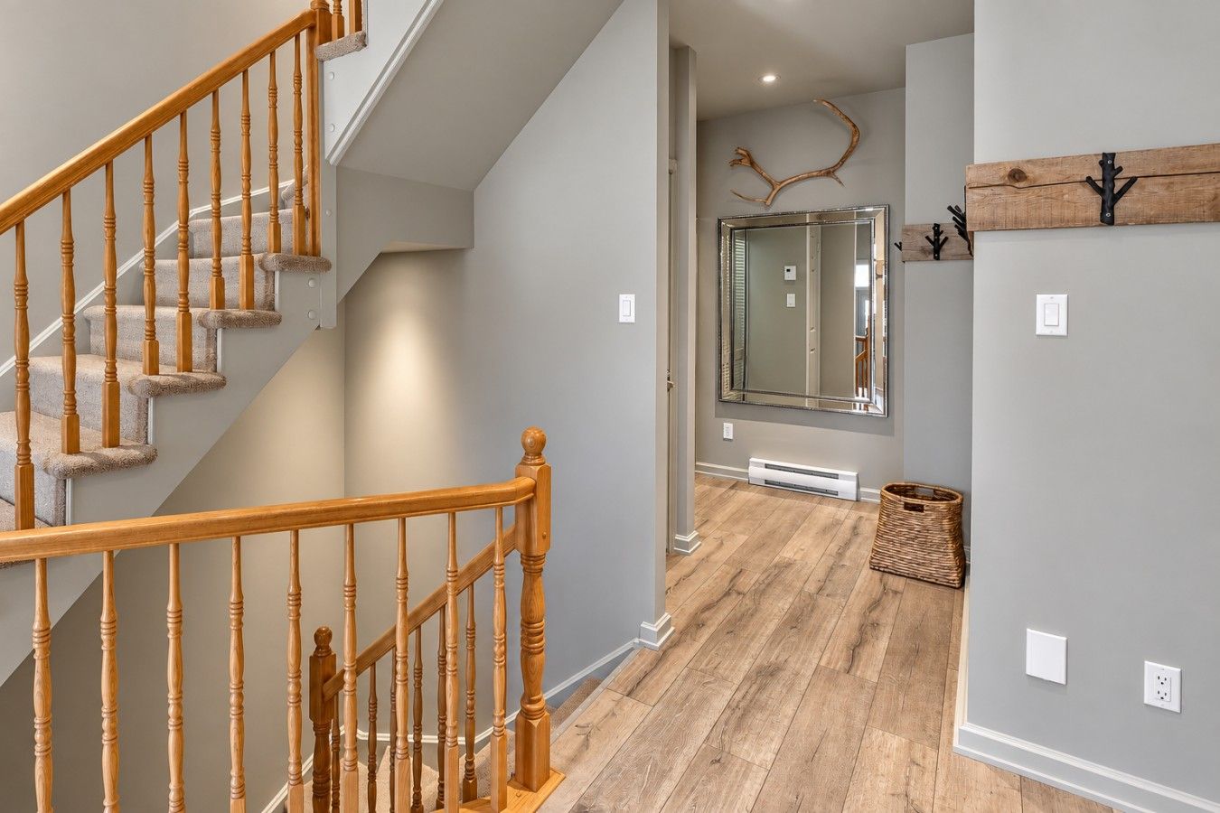 A staircase with wooden balusters leading to a landing.