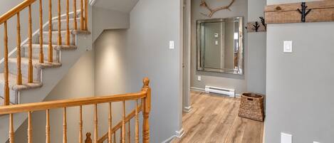 A staircase with wooden balusters leading to a landing.