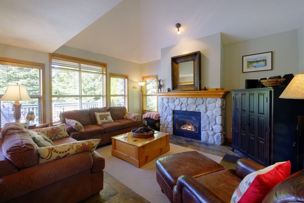 The cozy living room has games, DVD's, gas fireplace and a queen pullout couch.
