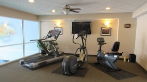 A gym with treadmills, an elliptical, and a stationary bike. - LAKEFRONT CONDO#111 3BR/2BA-private beach, indoor pool  Rent 3 get 4th free-ask (Geneva on the Lake)